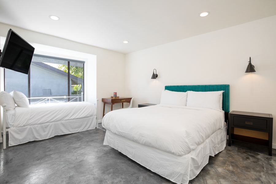 Bedroom with teal headboard